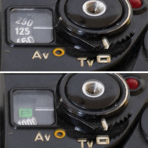 Canon A-1 - Shutter Priority Mode and Program Mode. The photographer can not pick the aperture, so the aperture dial is hidden and only the shutter speed values are shown.