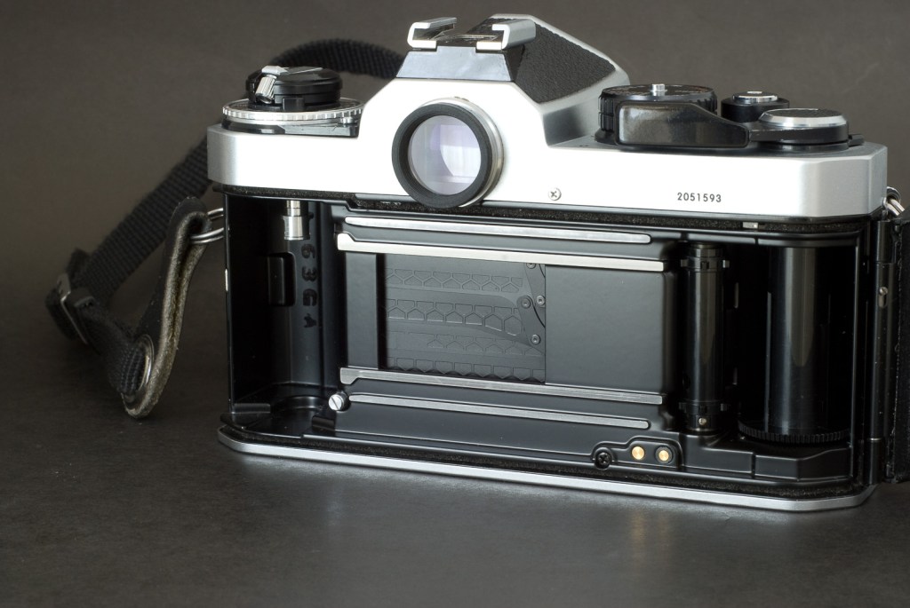 Nikon FE2 - the titanium honeycomb shutter blades of the early copies (like this one) was replaced later on with aluminum ones (for environmental concerns)