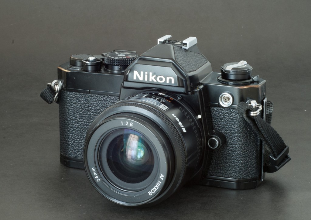 Nikon FM. Brassing on the edges of the top plate cover - no plastic here.